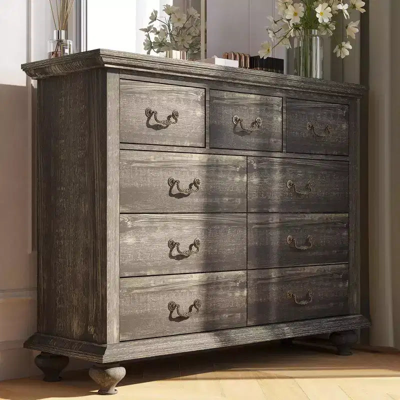 Bedroom vanity with intricately carved metal handles, featuring a tall cabinet with wooden legs. Suitable for bedrooms, living rooms, and hallways.